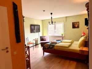 a bedroom with a bed and a living room at Fata Morgana in Cochem