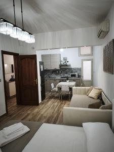a living room with a couch and a table at B&B Ampelea in Gallipoli