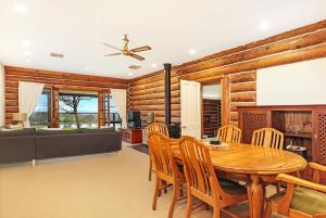 a dining room with a table and chairs at The Lodge at Eagle Rock Farm, in Mandemar