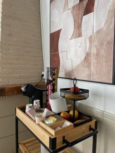 a wooden table with food on top of it at BOHEMIA SANLUCAR in Sanlúcar de Barrameda