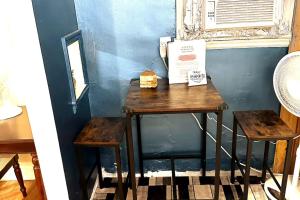a table with a box on it next to a window at Economy 3 beds in Moorhead