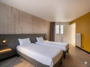 Katil atau katil-katil dalam bilik di B&B HOTEL Lorient Ploemeur
