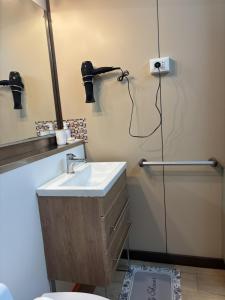 a bathroom with a sink and a mirror and a shower at The Lookout in Ghiffa +9 photos