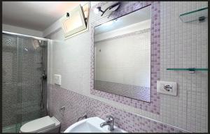 a bathroom with a sink and a mirror at B&B Ampelea in Gallipoli