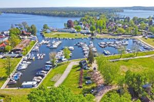 an aerial view of a marina with boats in the water at Hausboot in Berlin, festliegend im Yachthafen Schmöckwitz, mit Heizung in Berlin