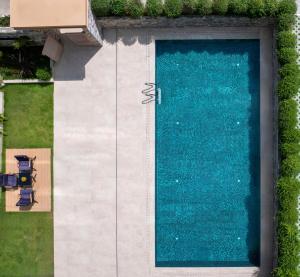 an overhead view of a swimming pool next to a yard at Yangshuo Xishan Resort in Yangshuo