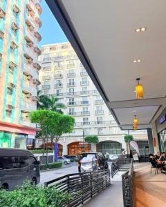 a view of a city street with a large building at Henry's Newport Condotel in Manila