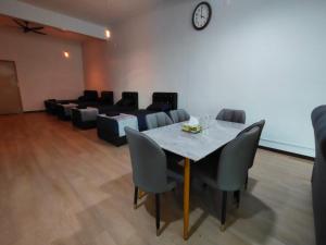 a dining room with a table and chairs at Kayangan Suite - Home Studio in Kangar +14 photos
