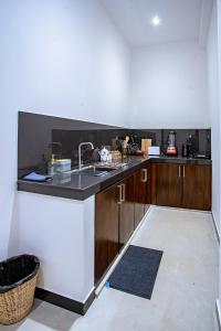 a kitchen with a sink and a counter top at Meys Hiriketiya in Dickwella