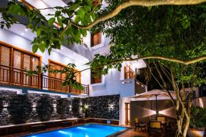 a swimming pool in the middle of a building at Meys Hiriketiya in Dickwella