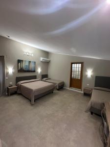 a bedroom with two beds and a ceiling at Il Gabbiano in Termini Imerese +104 photos