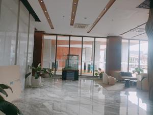 an office lobby with a lot of windows at Arc Tower Condominium 1930 and 1727 in Cebu City +22 photos