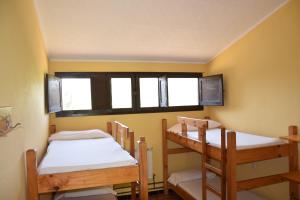 a room with two bunk beds and a window at Masia La Cadamont in Sant Joan les Fonts +22 photos