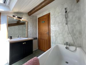 a bathroom with a bath tub and a sink at Xuhinxaharea in Banca +34 photos
