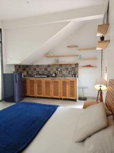 a kitchen with a blue rug in a room at The Peace Corgaon in Corgao