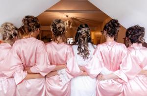 a group of bridesmaids dressed in pink at Hockley House in Hockley Heath