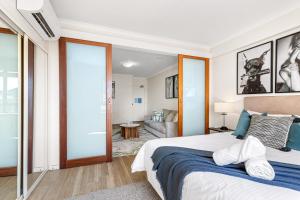 a bedroom with a bed and a living room at Walk & Wander - A Sepal Stay in Perth +13 photos