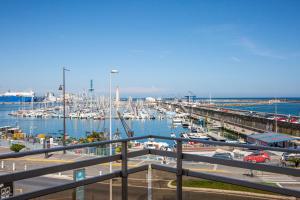 a marina with boats parked in the water at Hotel Port Marine in Sète
