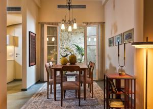 a dining room with a table and chairs at Vava Residence in Heraklio