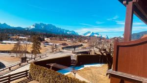 a view of the mountains from the balcony of a house at Abendsonne in Krün +14 photos