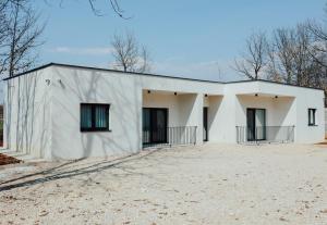 a large white building with a lot of windows at Villa Saint Hill in Međugorje