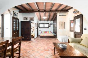 a living room with a couch and a table at Casa Bados in Dorgali +74 photos
