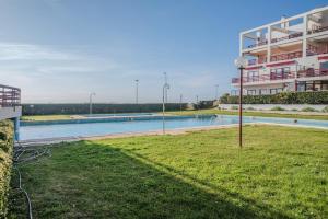 a swimming pool in front of a building at Spacious Seafront Residence - Family Friendly in Vila Nova de Gaia