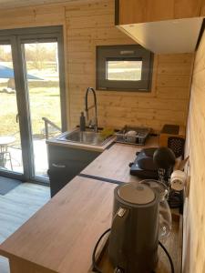 a kitchen with a sink and a counter top at maringotky Šumava in Dlouhá Ves