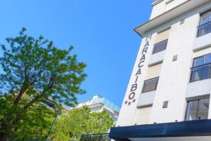 a building with a sign on the side of it at MH Hotel Maracaibo in Rimini +9 photos