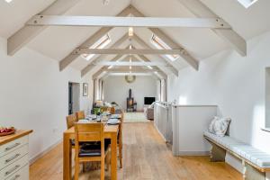 a kitchen and living room with a table and chairs at 3 Bed in Hayle oc-78551 in Hayle