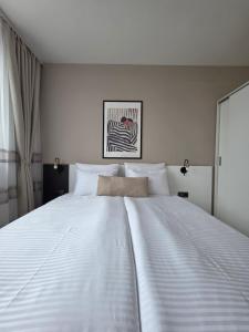 a large white bed in a hotel room at APart Residence Shumen 1 in Shumen