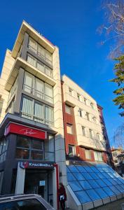 a building with a solar panel on the front of it at APart Residence Shumen 1 in Shumen