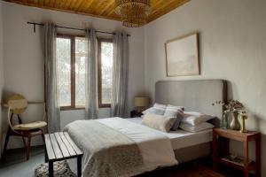 a bedroom with a large bed and a window at The Garden Home in Arusha