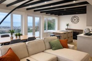 a living room with a couch and a table at Valdermosa in Newlyn