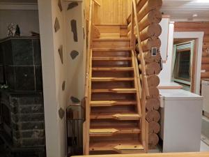 a wooden staircase in a tiny house at Kangasjärvi in Pudasjärvi +23 photos