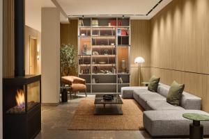 a living room with a couch and a fireplace at Eurostars Old Montreal Suites & Apartments in Montreal