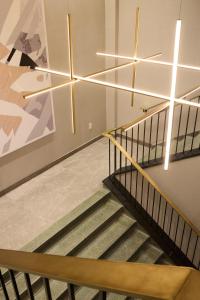 a staircase in a building with a painting on the wall at Eurostars Old Montreal Suites & Apartments in Montreal +57 photos