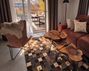 a living room with a couch and a table at Gajówka in Istebna