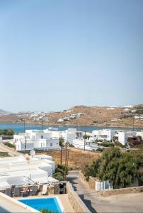 a view of a resort with a pool and buildings at Villa Magenta in Mikonos