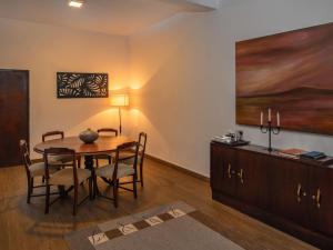 a dining room with a table and chairs at Swarga Villa in Kandy