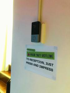 a sign on a door that says your pathfinding to repetition just stress and progress at Hotel Rue De Siam in Chinatown