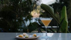 a drink sitting on a table next to a plate of food at Motel 98 in Rockhampton