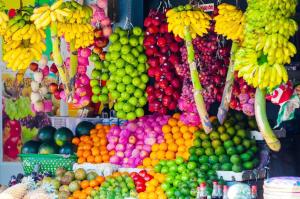 a display of fruits and vegetables in a market at Rose Lagoon Hotel in Vakarai +40 photos