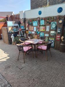 a table and chairs sitting in front of a building at D'n Engel in Sittard