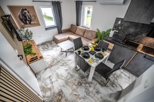 an overhead view of a living room with a table and chairs at MVSV Apartment in Kamnik