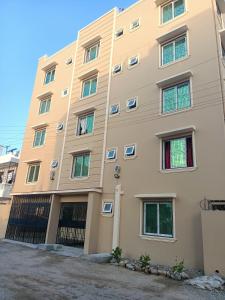 a large building with many windows at Ardina Studio in Mtwapa +21 photos