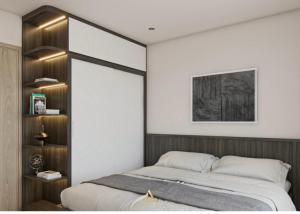 a bedroom with a large bed with a wooden headboard at VHGP-Bs10 in Long Bình