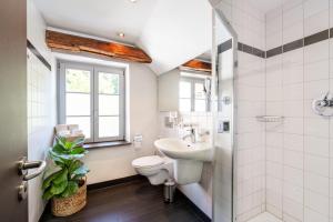 a bathroom with a sink toilet and a window at Buhlsche Mühle in Ettlingen +60 photos