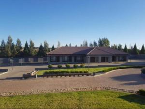 a large building with a driveway in front of it at 2nd Cozy Corner in Highlands