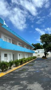 a parking lot next to a large building at Hotel center in Las Terrenas
